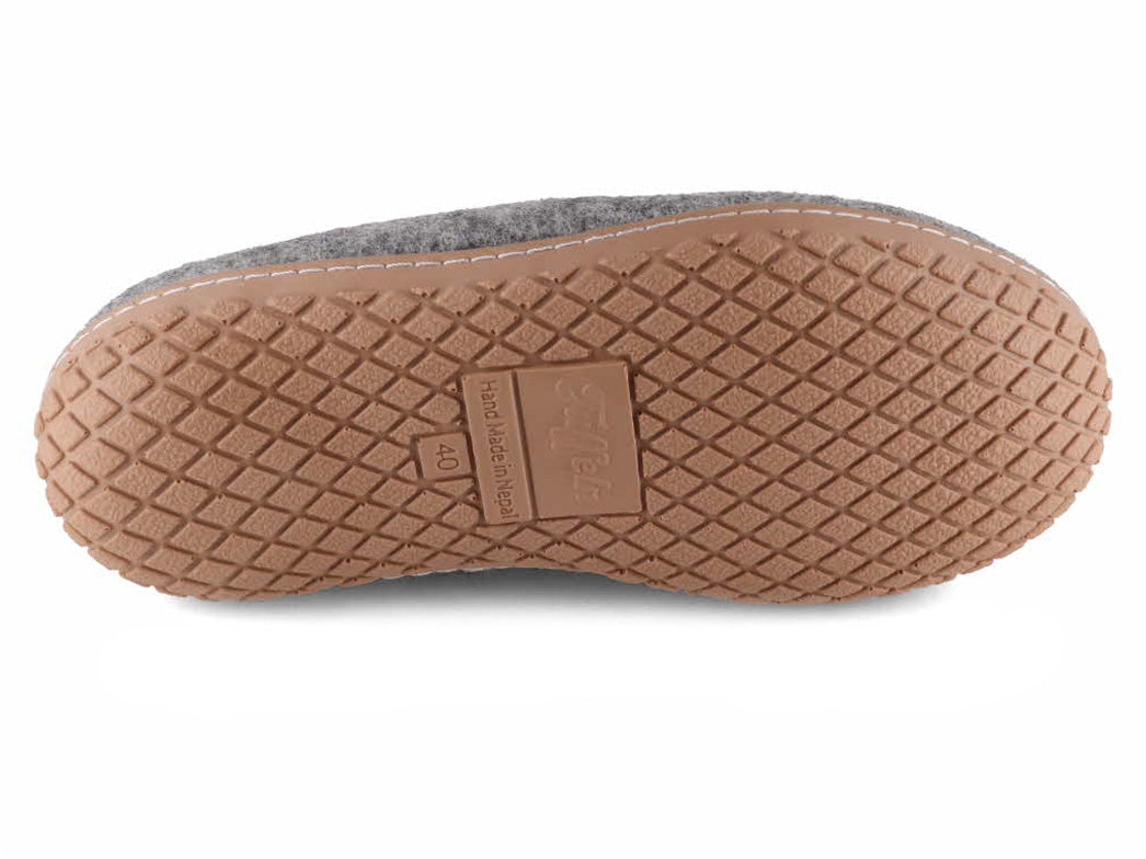 Tan geometric-tread outsole of Tuffeln Pantuffel light gray wool felt slippers, bottom view