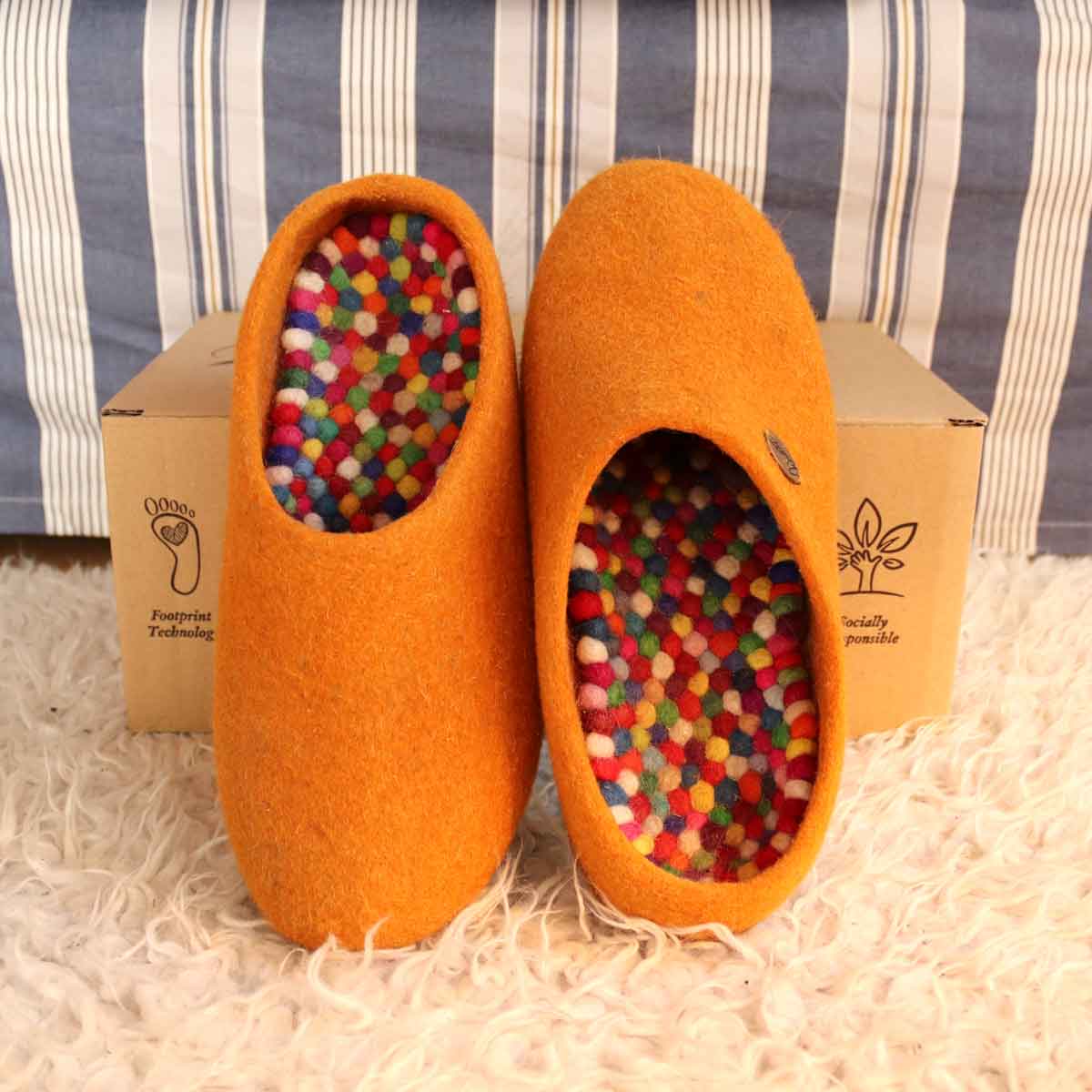 Colorful WoolFit FeelGood footbeds inside orange felt slippers