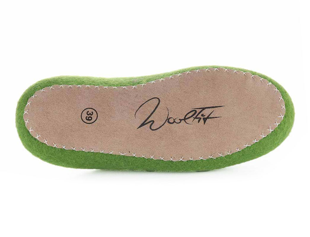 WoolFit Tibet Hand-Felted Wool Slippers in Grass Green, wool felt, outsole view; pair lifestyle layout